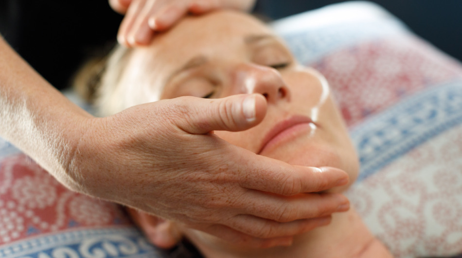 Lucy carrying out a gentle facial massage treatment